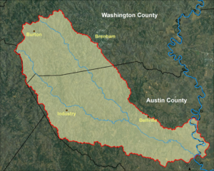 A map of the Mill Creek Watershed, with the cities of Burton, Brenham, Industry, and Bellville marked. The boundaries of Washington and Austin Counties are also indicated.
